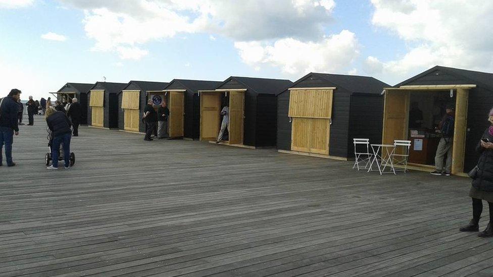 Beach-hut kiosks at Hastings Pier