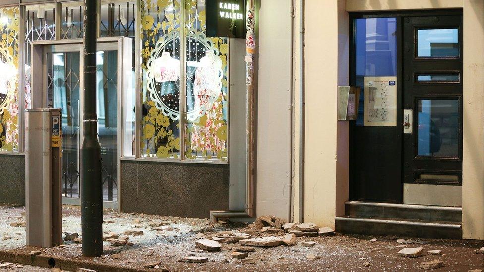 Glass and rubble covers the footpath on Wakefield Street after an earthquake on November 14, 2016 in Wellington, New Zealand