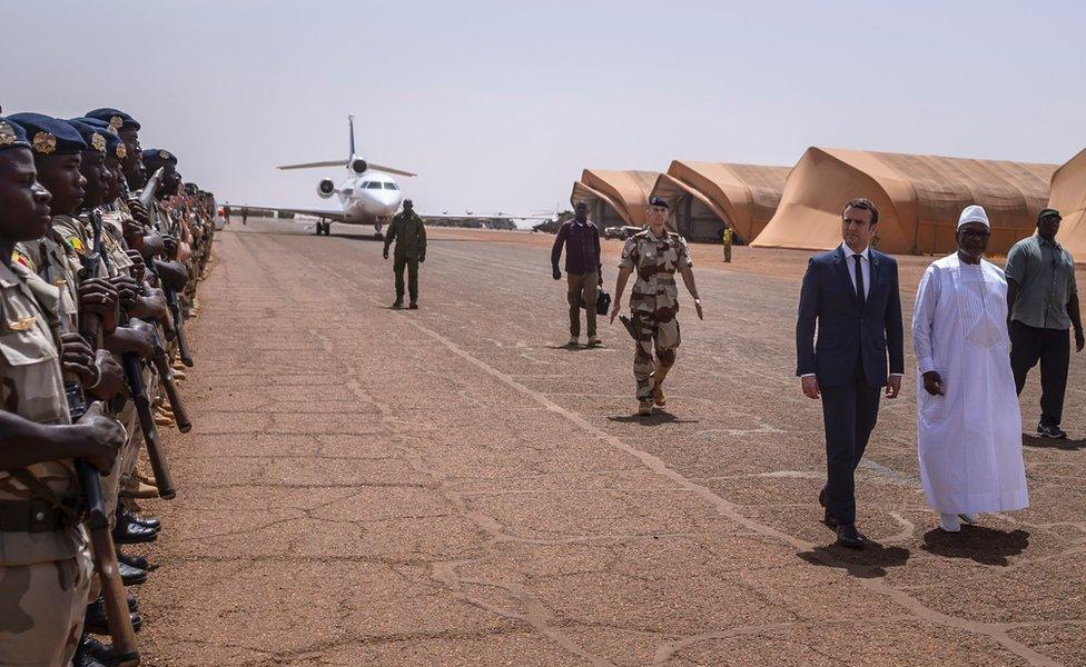 On Friday, French President Emmanuel Macron and his Mali counterpart President Ibrahim Boubacar Keita inspect a guard of honour during a visit in Gao, northern Mali