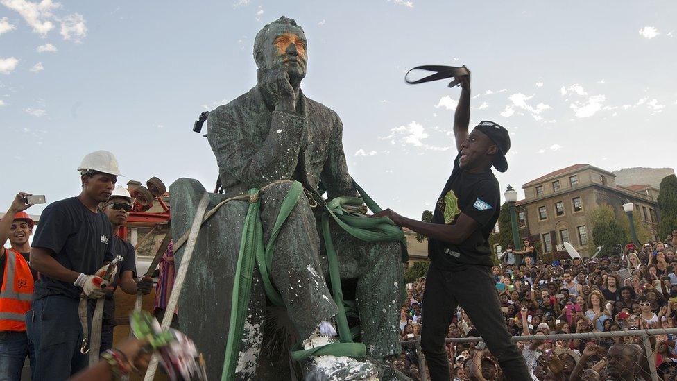 Students attack the statue of Cecil John Rhodes as it's removed at the University of Cape Town in South Africa in 2015.