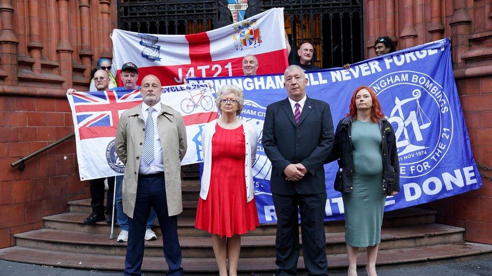 Julie Hambleton and others gather on the steps of the court