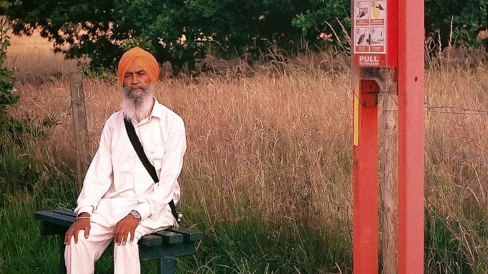 A man on a bench in West Bromwich