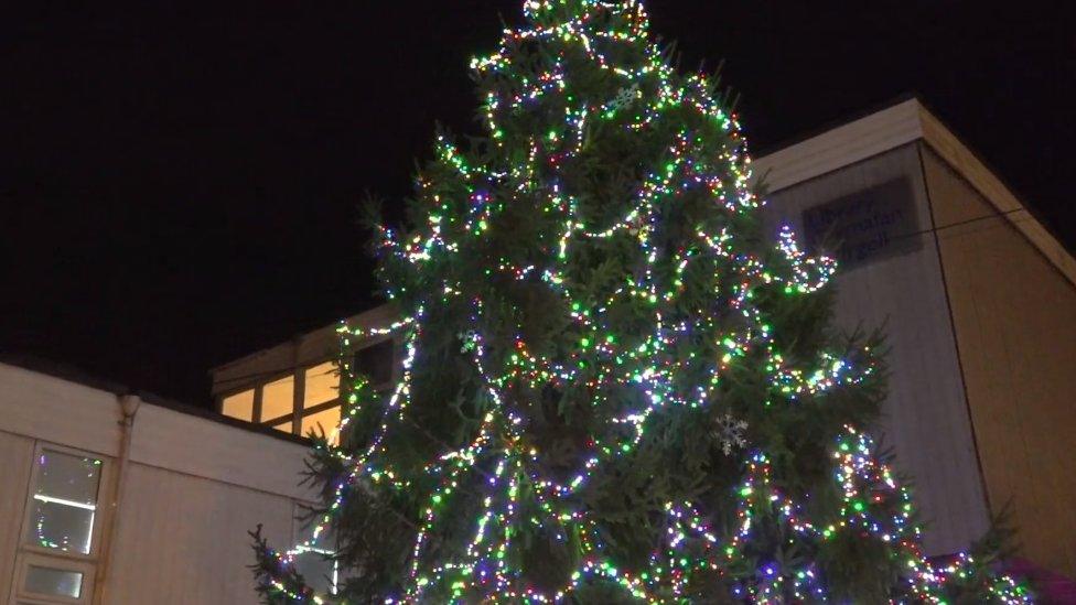 Christmas tree lit with decorations at Cwmavon