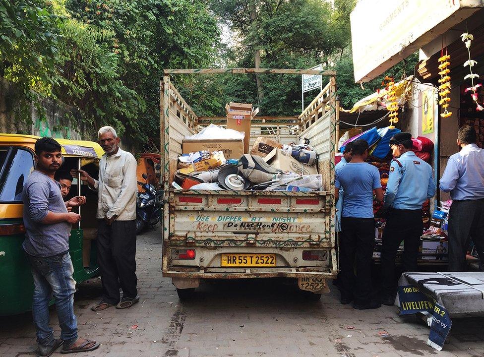 Govind's white van in which he collects all the scrap.