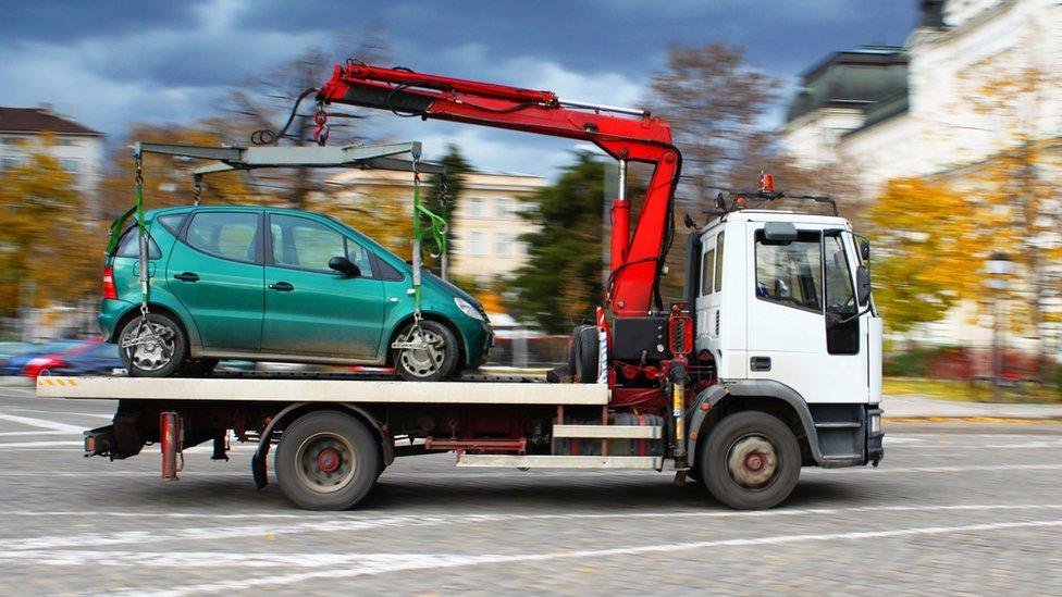 tow lorry with car