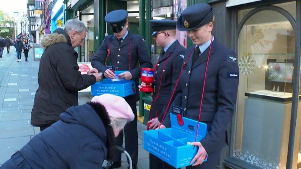 People give to collection in Market Square