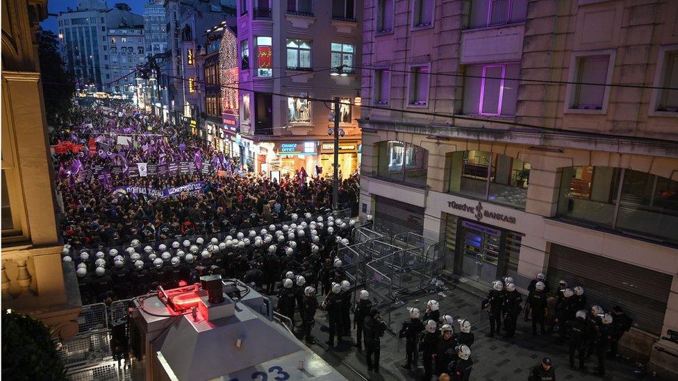 Turkish anti riot police officers block the street as demonstrators gather on Istiklal avenue in Istanbul