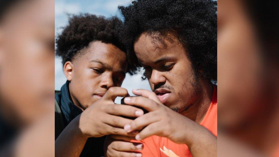 Ciara Hillyer's photo submission to Portrait of Britain awards. Shows Wolverhampton boys Isaac and Nima touching hands