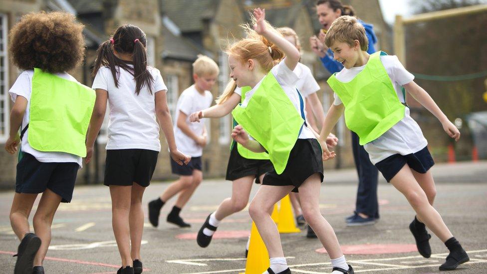 Children practising sport in school