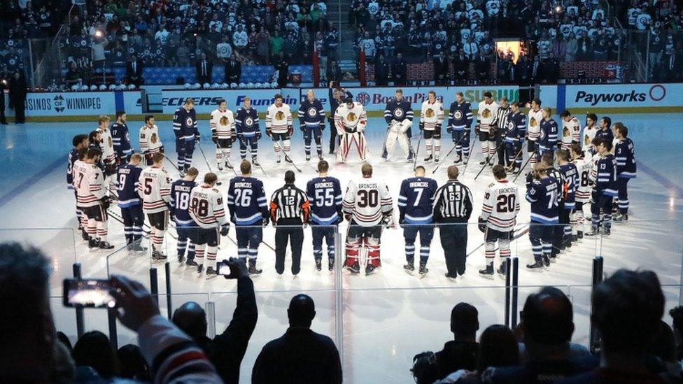 Winnipeg Jets and Chicago Blackhawks players honour crash victims before Saturday's game