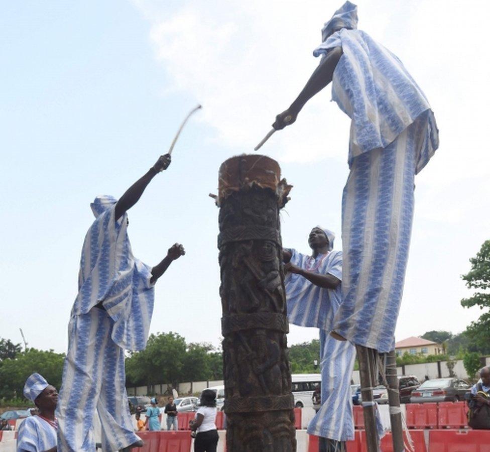 Drummers beat a record 16-feet tallest traditional drum during the first ever Nigerian drums festival in Abeokuta, southwest Nigeria, on April 22, 2016.
