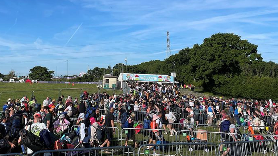 Crowds queue up outside the Isle of Wight Festival site