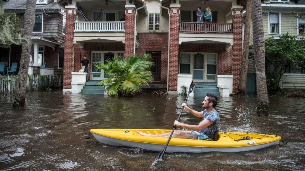 Justin Hand navigates storm surge flood waters from Hurricane Irma along the St. Johns River on Sept. 11, 2017 in Jacksonville, Florida