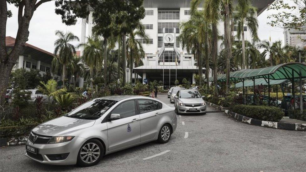 A Royal Malaysian police car convoy which is believed to contain Doan Thi Huong from Vietnam and Siti Aisyah from Indonesia leaves the Shah Alam High Court ahead of the trial of suspects in the assasination of North Korean leader"s Kim Jong-un"s half-brother in Shah Alam, Malaysia, 02 October 2017.