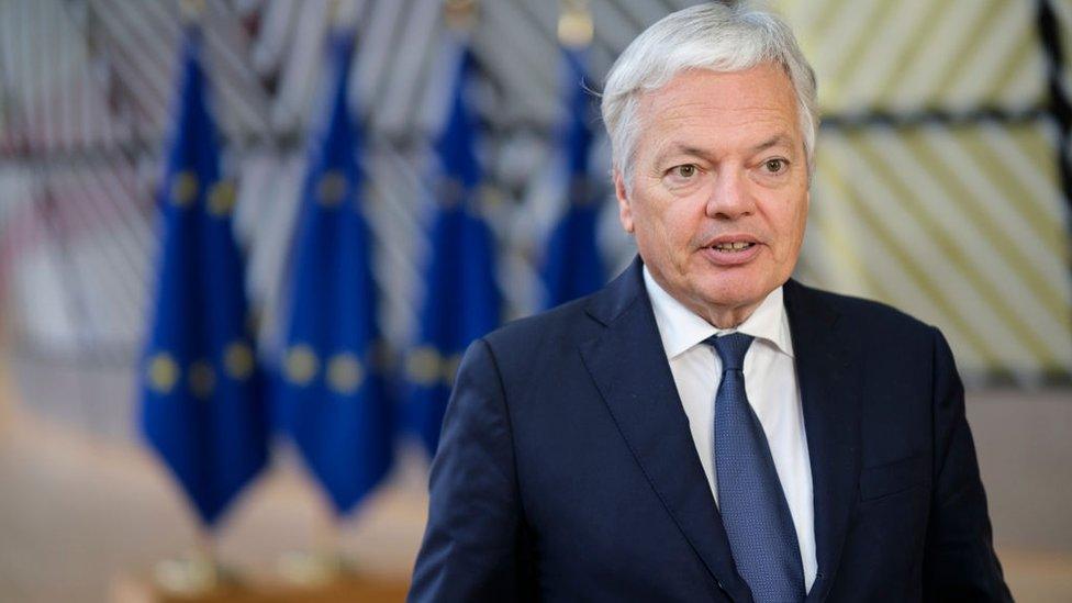 Didier Reynders speaking to reporters