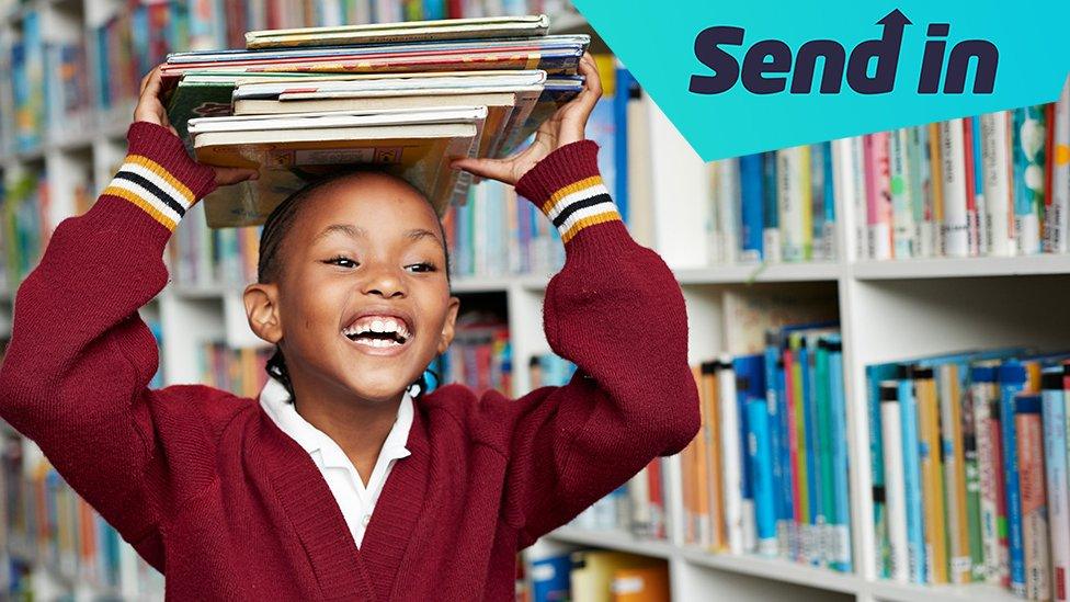 girl carrying library books