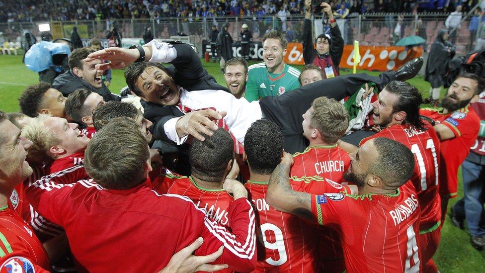 Wales' head coach Chris Coleman celebrates with players after qualifying for Euro 2016 at the Stadium Bilino Polje in Elbasan.