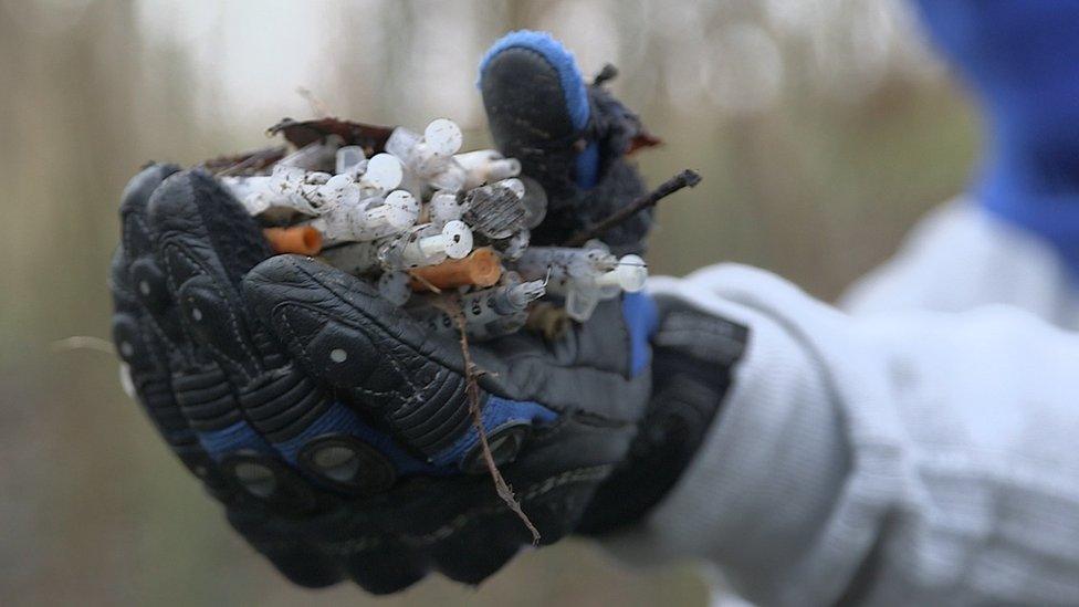 Handfuls of syringes used by addicts