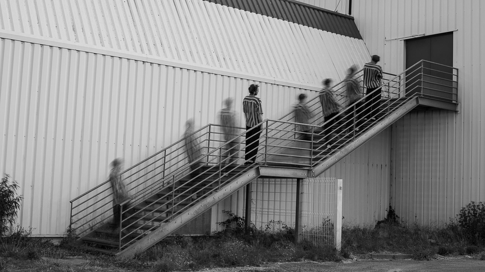 blurred image of man on steps