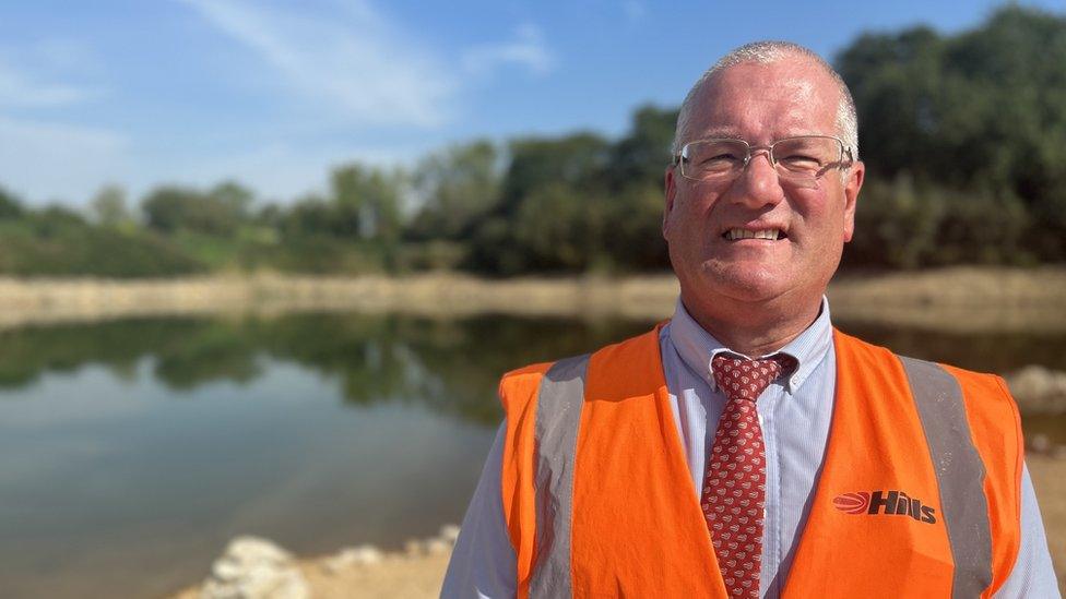 Peter Andrew, group director of hills quarry products, standing in front of the excavation site