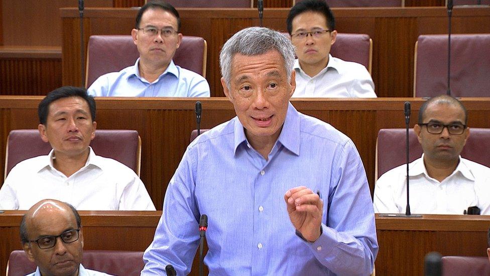 This handout photo released by the Ministry of Information and Communication (MCI) on 3 July 2017 shows Singapore Prime Minister Lee Hsien Loong speaking at parliament house in Singapore