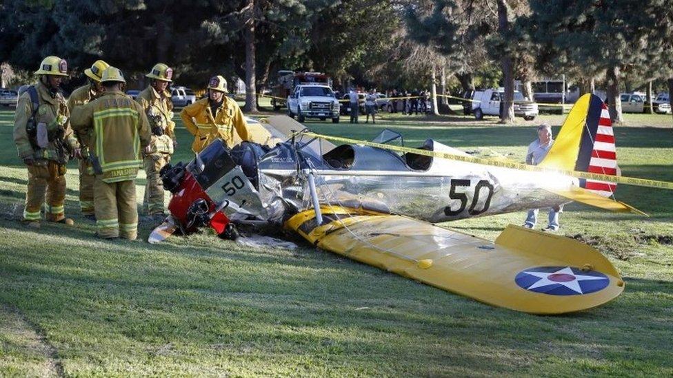 Emergency services inspect the scene after a plane flown by Harrison Ford crashed in LA