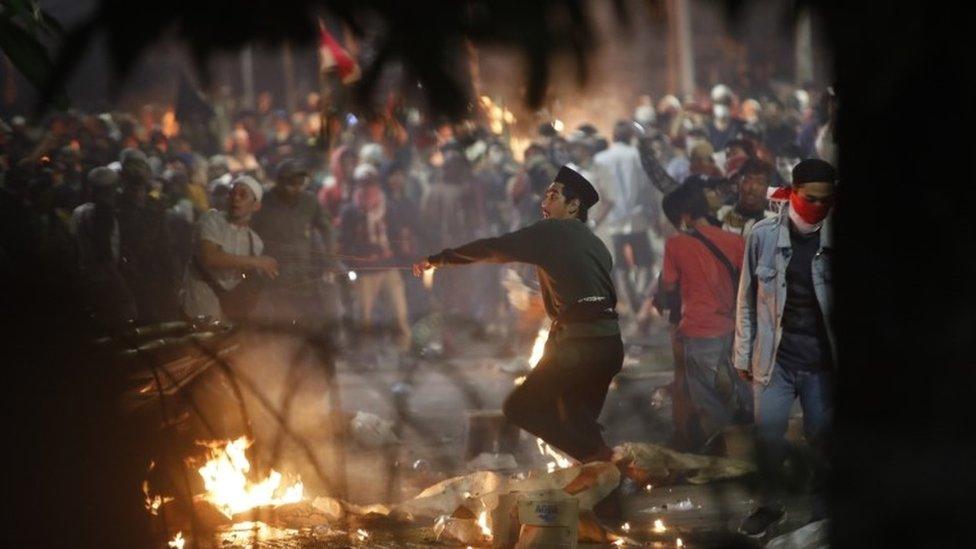 Protesters hurl missiles towards police during renewed clashes on Wednesday