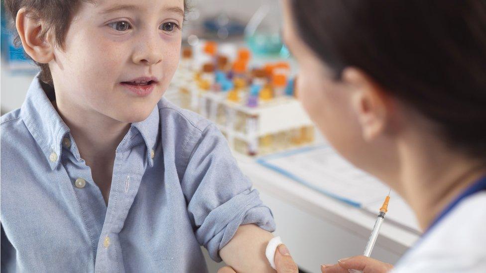 Young boy being vaccinated