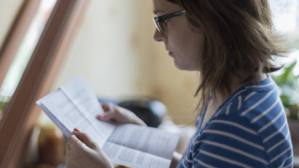 Woman reading official letter