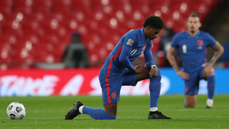 Marcus Rashford taking the knee