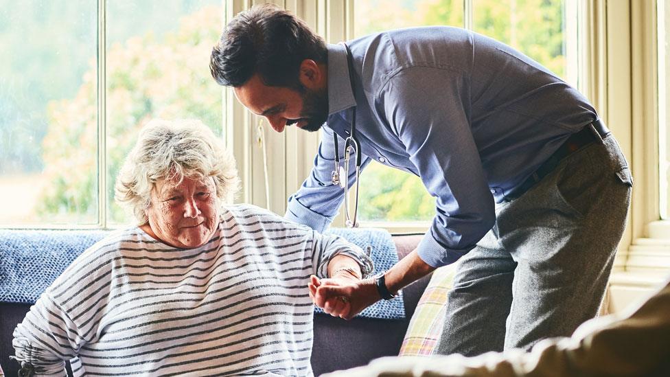 Carer helps patient