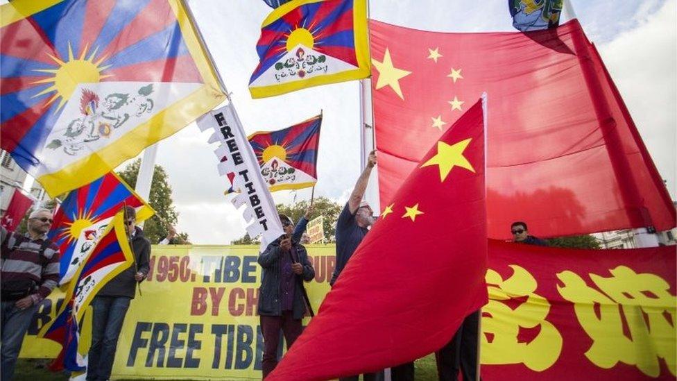 Protests breaking out on Parliament Square over China's human rights record.