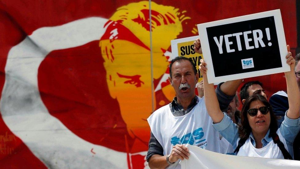 Members of the Journalists Union of Turkey (TGS) shout slogans during a demonstration to mark World Press Freedom Day in central Istanbul, Turkey on 3 May, 2017. The placard reads: "Enough!"