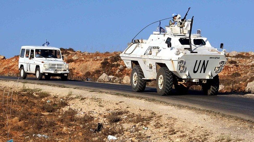 Vehicles of a convoy United Nations Interim Forces in Lebanon (UNIFIL) ride on a road along the border between Lebanon and Israel