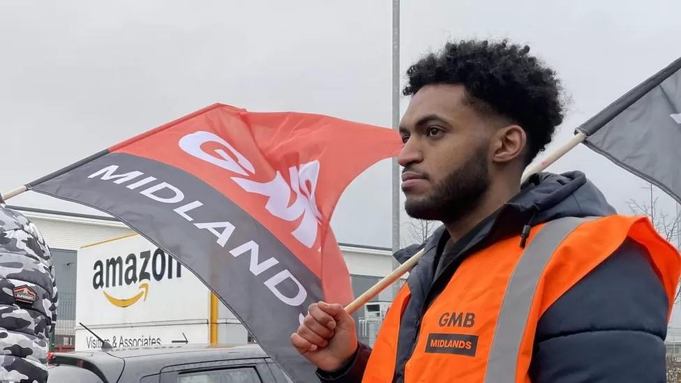 Worker holding a flag