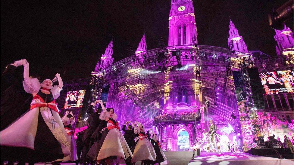 People dance in front of Vienna's City Hall