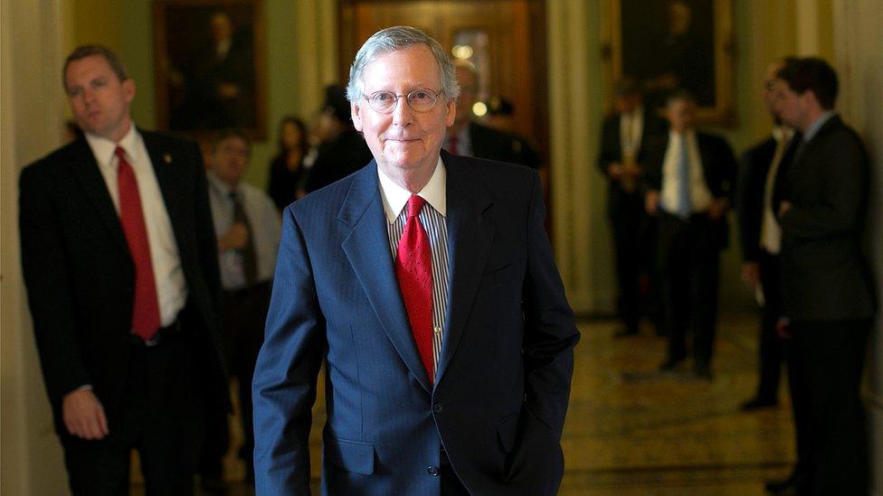 Senate Minority Leader Mitch McConnell returns to his office after a meeting of Senate Republicans at the U.S. Capitol October 15, 2013