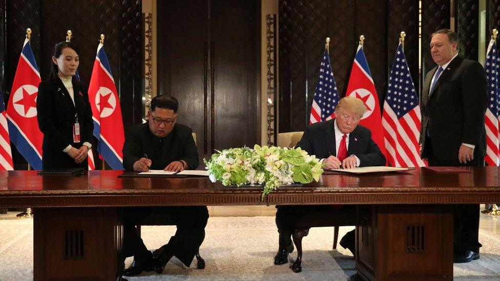 U.S. President Donald Trump and North Korea"s leader Kim Jong Un sign documents that acknowledge the progress of the talks and pledge to keep momentum going,