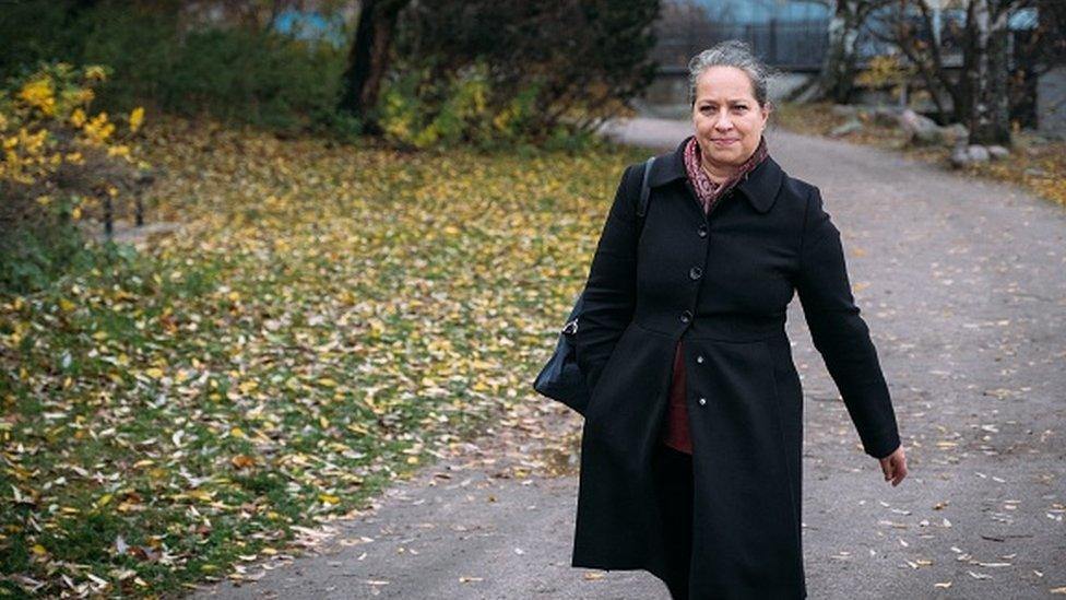 Ilona Taimela walking down a street