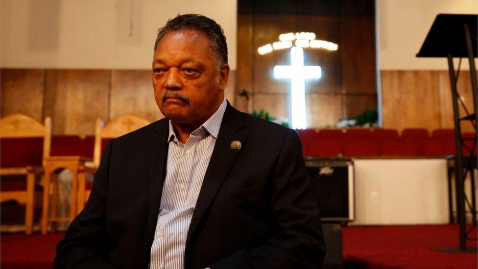 Rev Jesse Jackson sitting in a church