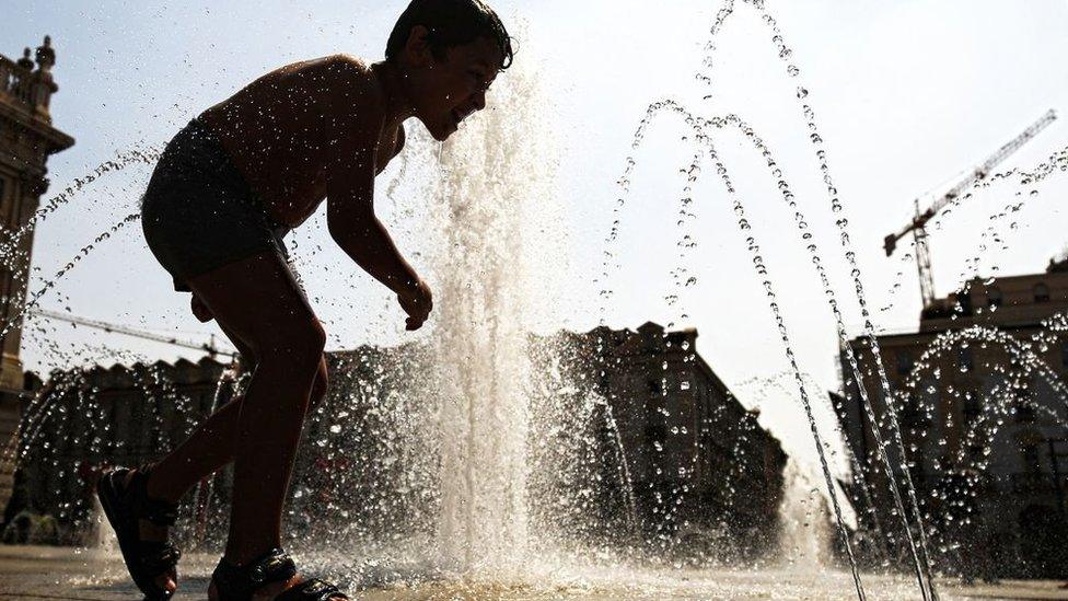 Child in fountain