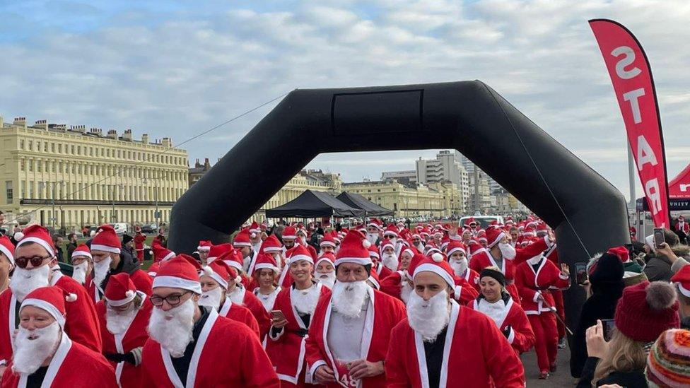 Santas leave the start line