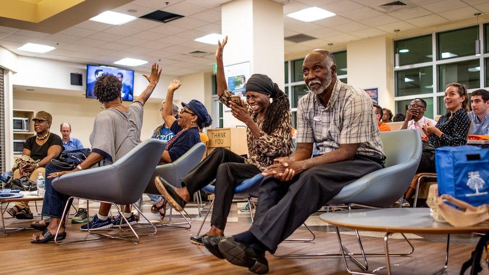 Supporters of Andrew Gillum listen during a recent debate between Mr Gillum and Ron DeSantis