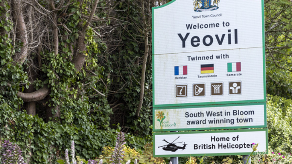 Welcome to Yeovil sign with added slogan reading 'Home of British Helicopters'