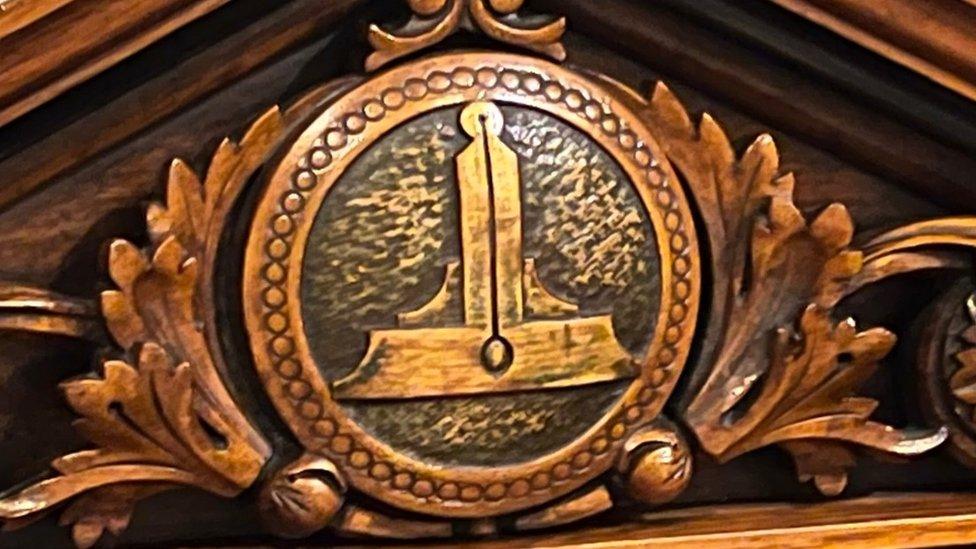 A Freemasons symbol on a chair