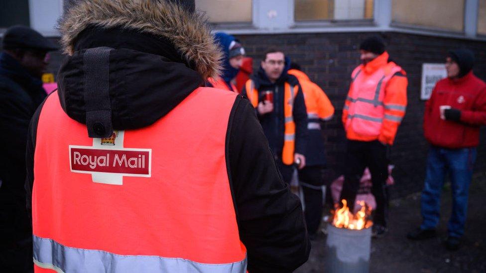 Strikers wearing Royal Mail jackets