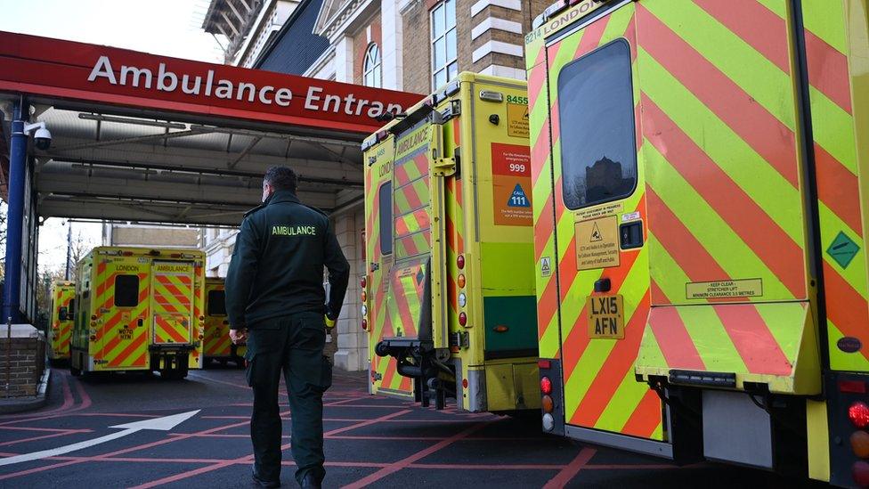 Ambulance staff outside a hospital in London