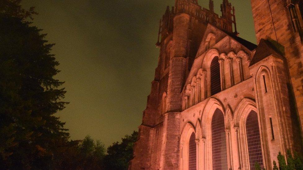 Llandaff Cathedral lit up in red light