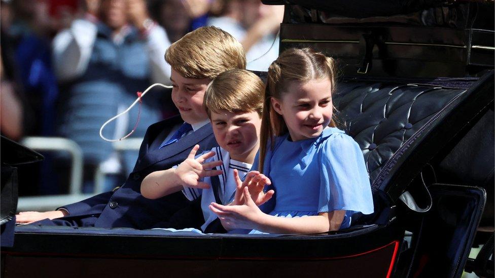 Britain"s Princess Charlotte, Prince George and Prince Louis ride in a carriage during the Trooping the Colour parade