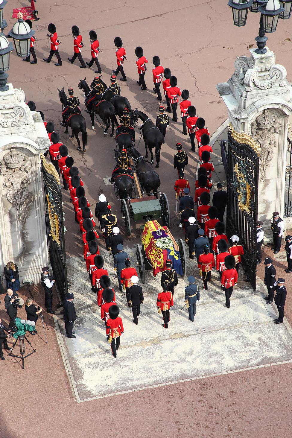 King Charles III and members of the royal family behind Queen Elizabeth II's flag-draped coffin as it is taken in procession on a Gun Carriage of The King's Troop Royal Horse Artillery from Buckingham Palace to Westminster Hall on 14 September 2022